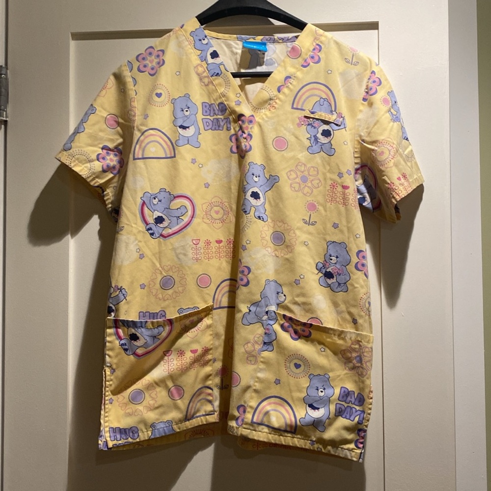 2 Medium sized scrubs. Ladies. (2 tops)